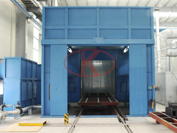 Large castings to track conveyor curtain spray booth