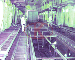 Track conveyor system and abrasive mechanical recycling system in container sandblasting booth